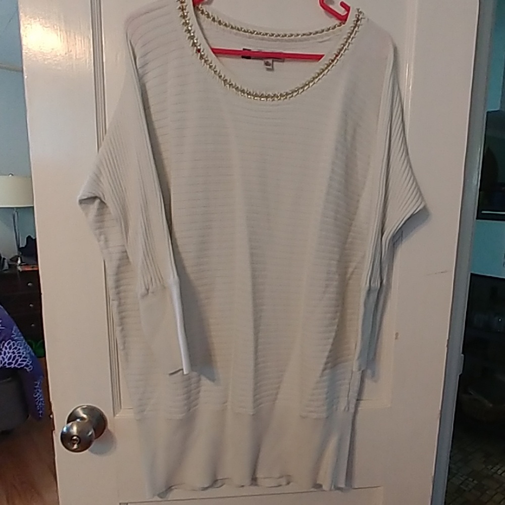 White sweater with silver detail